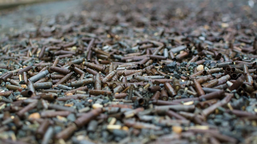 a bunch of brown metal pipe laying next to each other