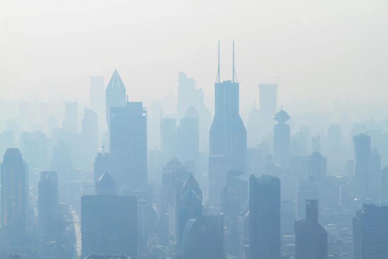 an aerial view of a city covered in fog