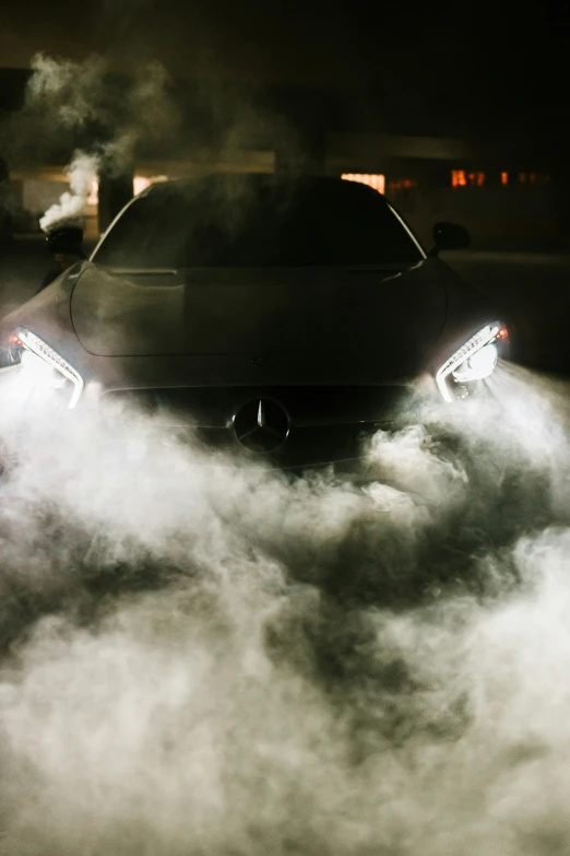 car on street near building with exhaust pipes in the front