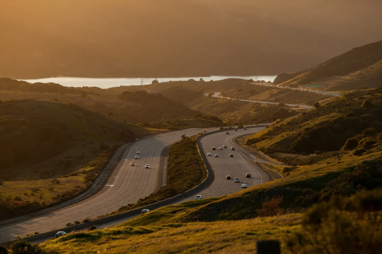 there are many cars traveling along this curve