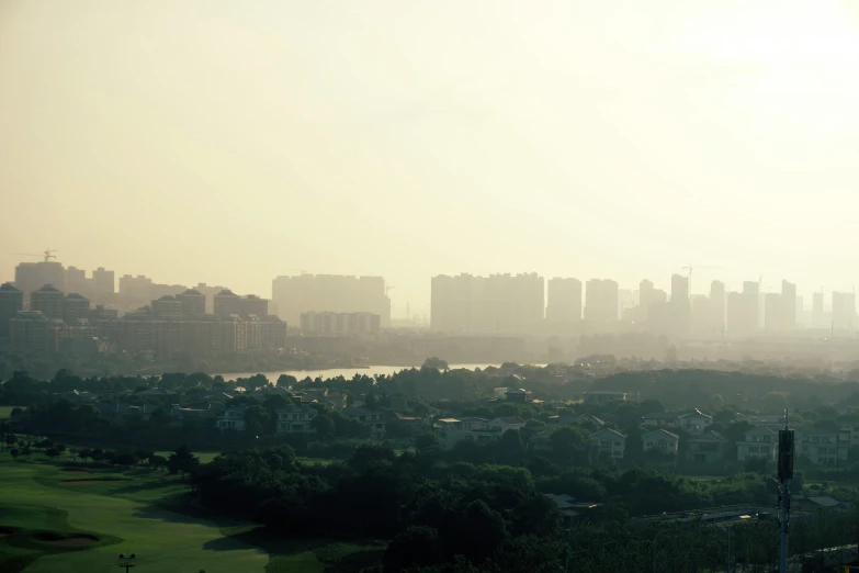 a city skyline with tall buildings in the distance