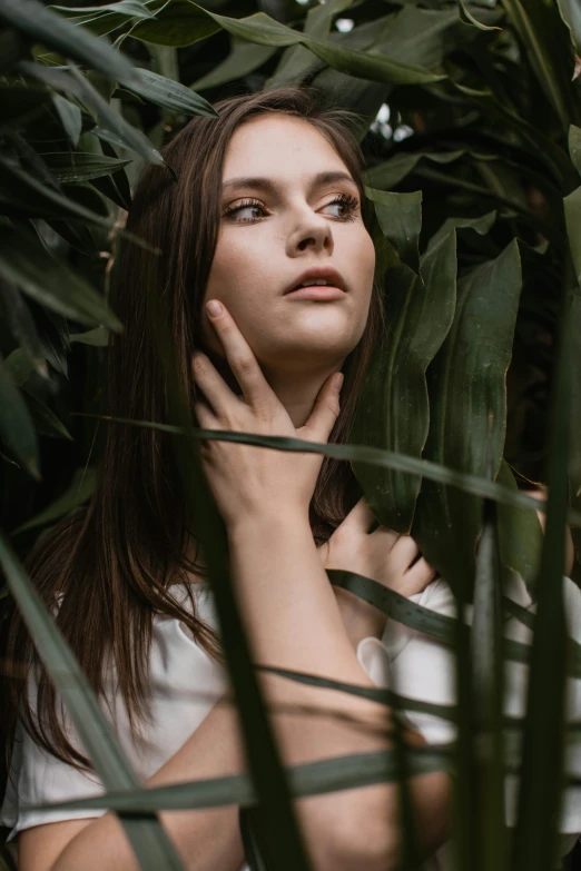 a girl with long hair posing in a tree