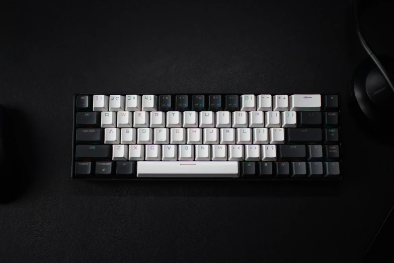 a black keyboard and mouse on a desk