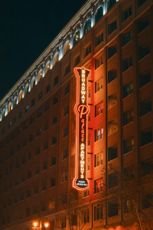 a lit building and street light at night