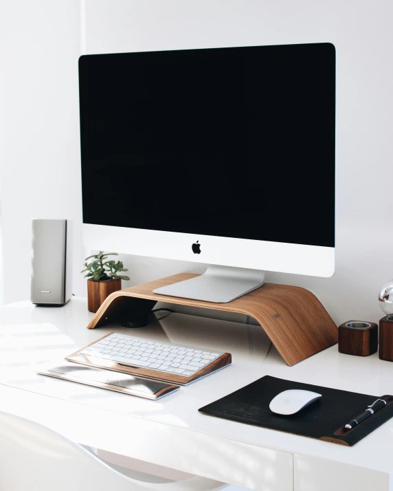 a home computer monitor on a white desk