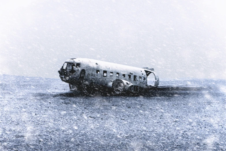 a plane is on a landing strip in the snow