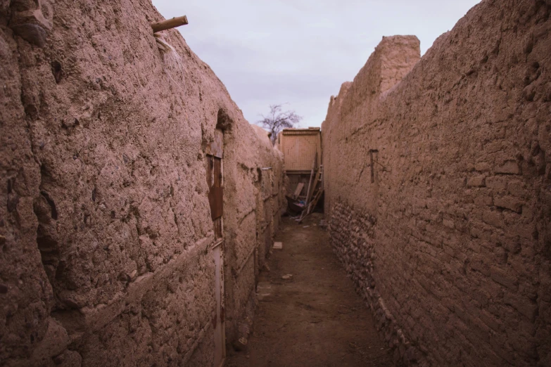 narrow alley with small stones lining walls