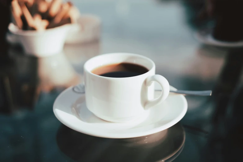 a coffee cup with some kind of stick sticking out of it