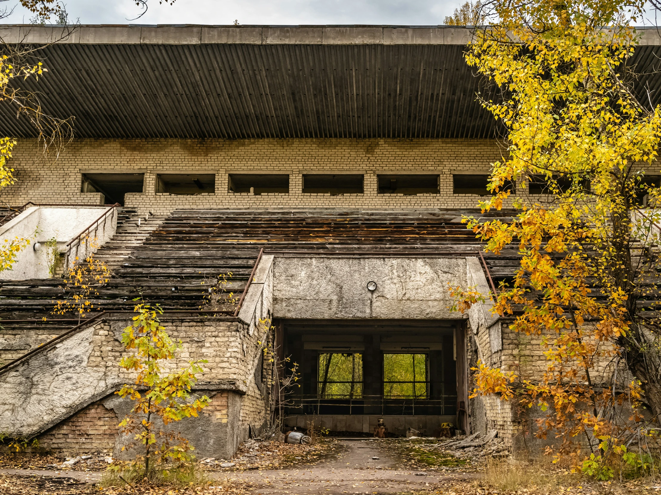 old abandoned building with several floors and windows in front