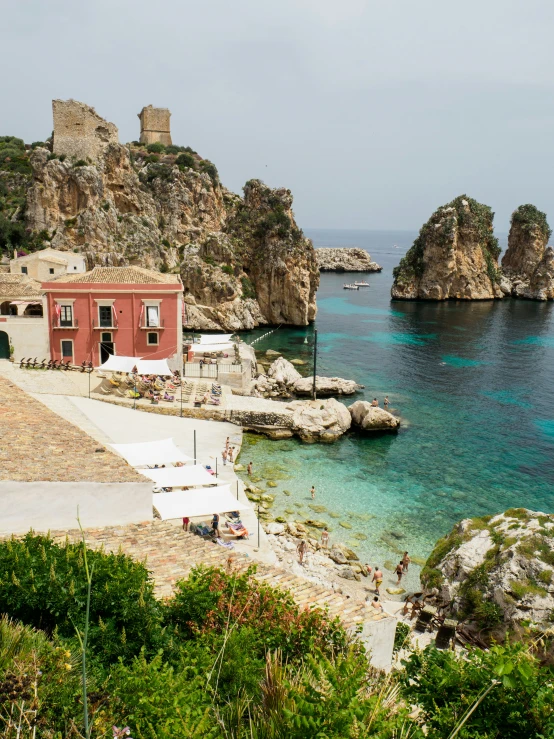 a small beach with houses in the water