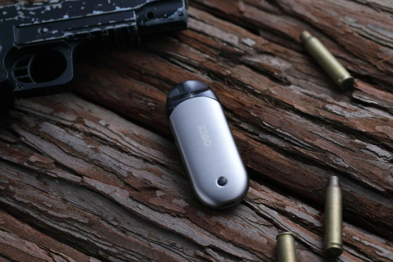 a gun and some bullet shells on a table