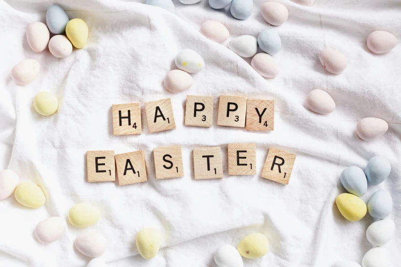 the words happy easter spelled with small rocks