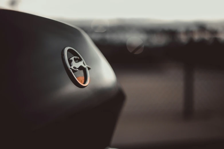 closeup of the emblem on a black car