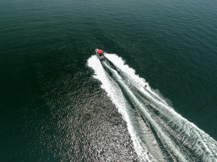 an aerial view of a speed boat in the water