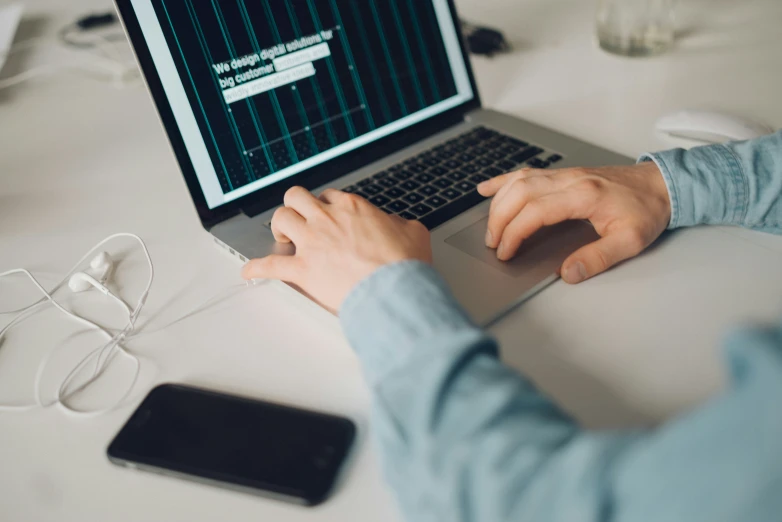 a person uses a laptop at a table