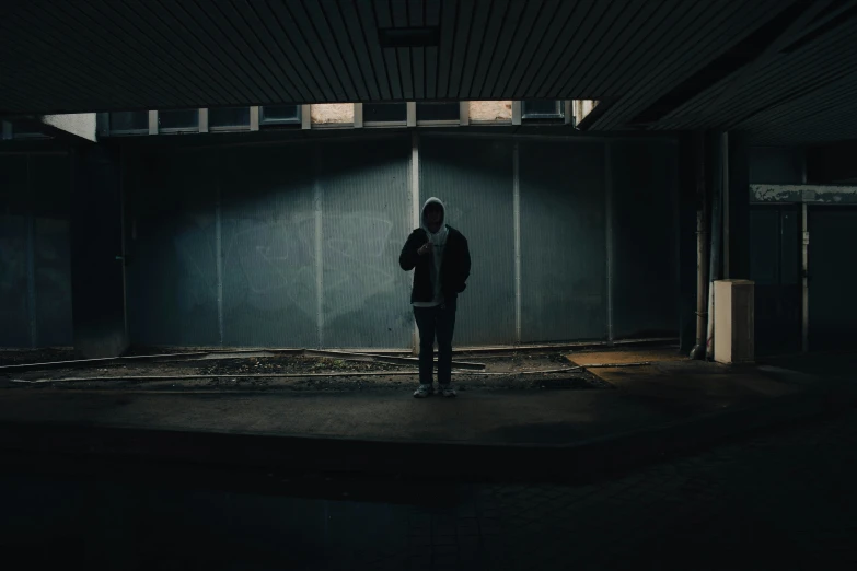 person standing in front of closed doors holding a knife