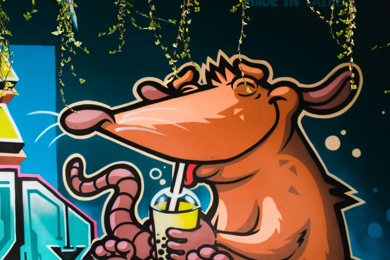 a painting of a cartoon rat on a wall next to some building