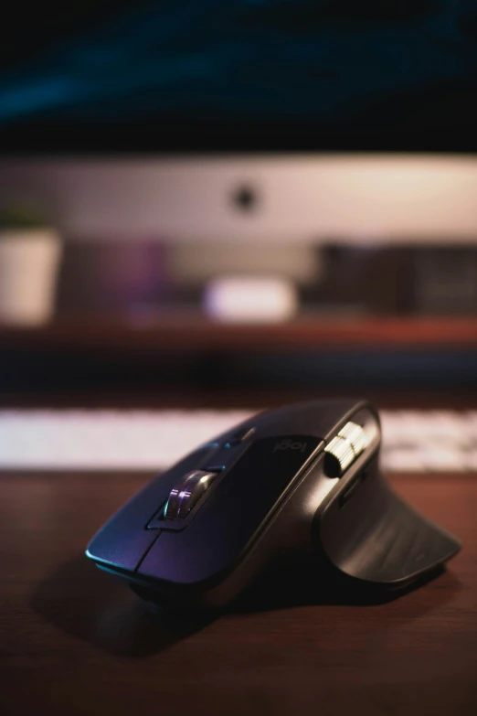 a computer mouse sits on top of a wooden table