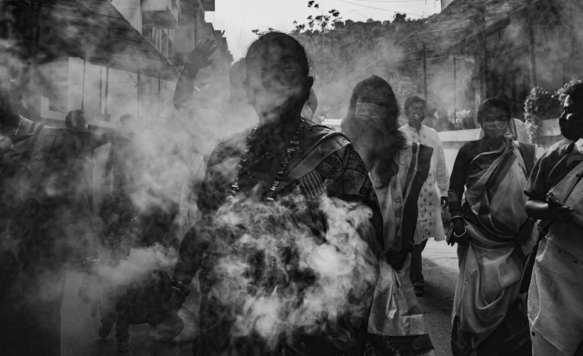 black and white pograph of people standing outside a building