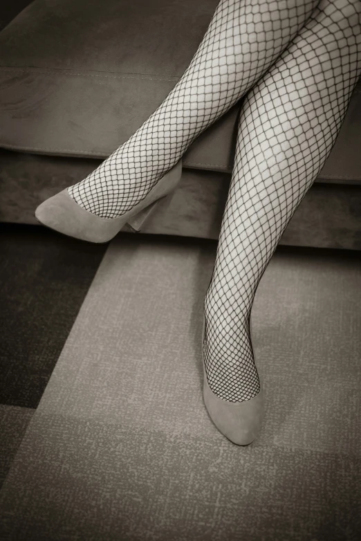 a person with fish net stockings and tights on