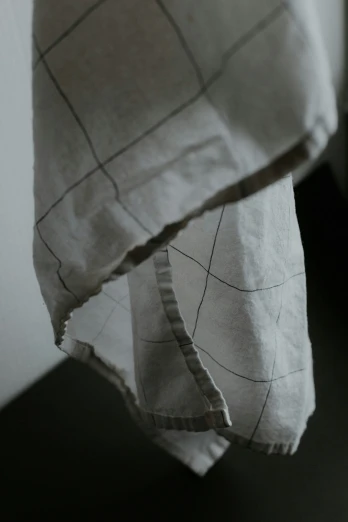 a piece of white cloth wrapped up on a table