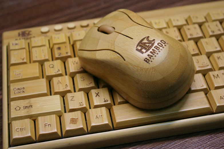 the wireless keyboard with carved wooden mouse pad