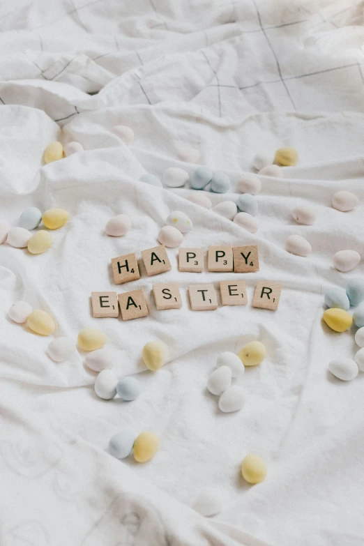 easter spelled in scrabbles with a background of pastel dots