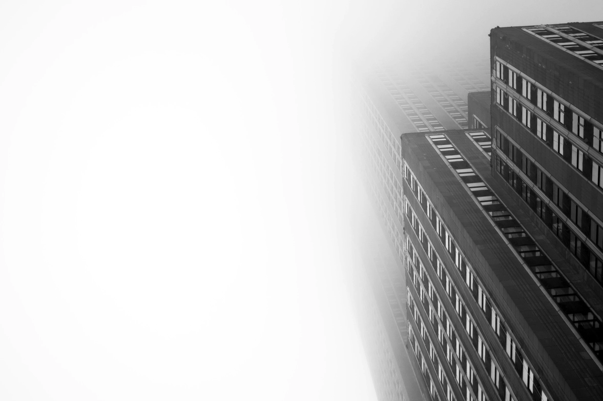 tall buildings in the fog on a cloudy day