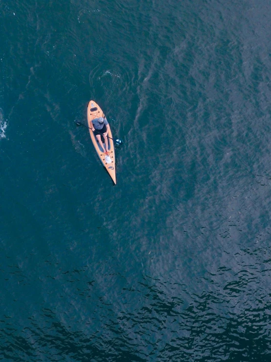 a view of the sea with a person rowing