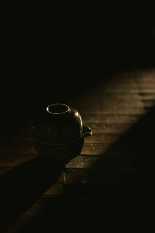 the shadow of a teapot against the wall