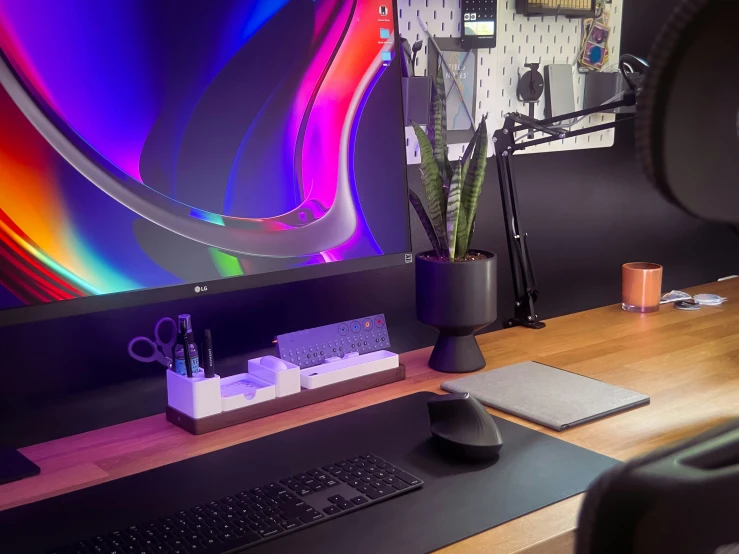 an office desk with a computer monitor, keyboard and mouse