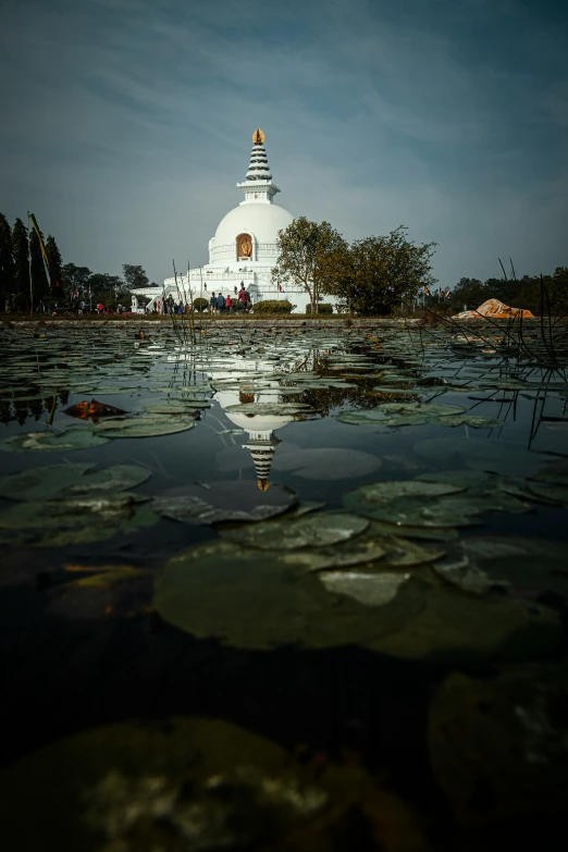 reflection of a spire in the water