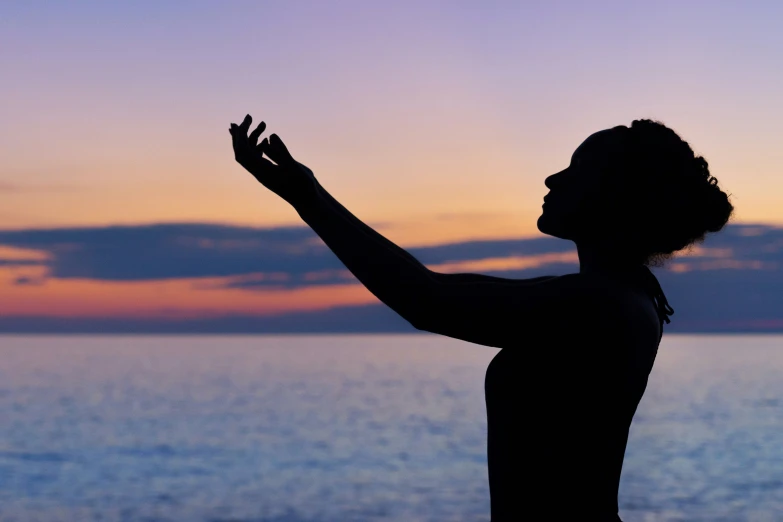 a man with a camera catches the sun setting