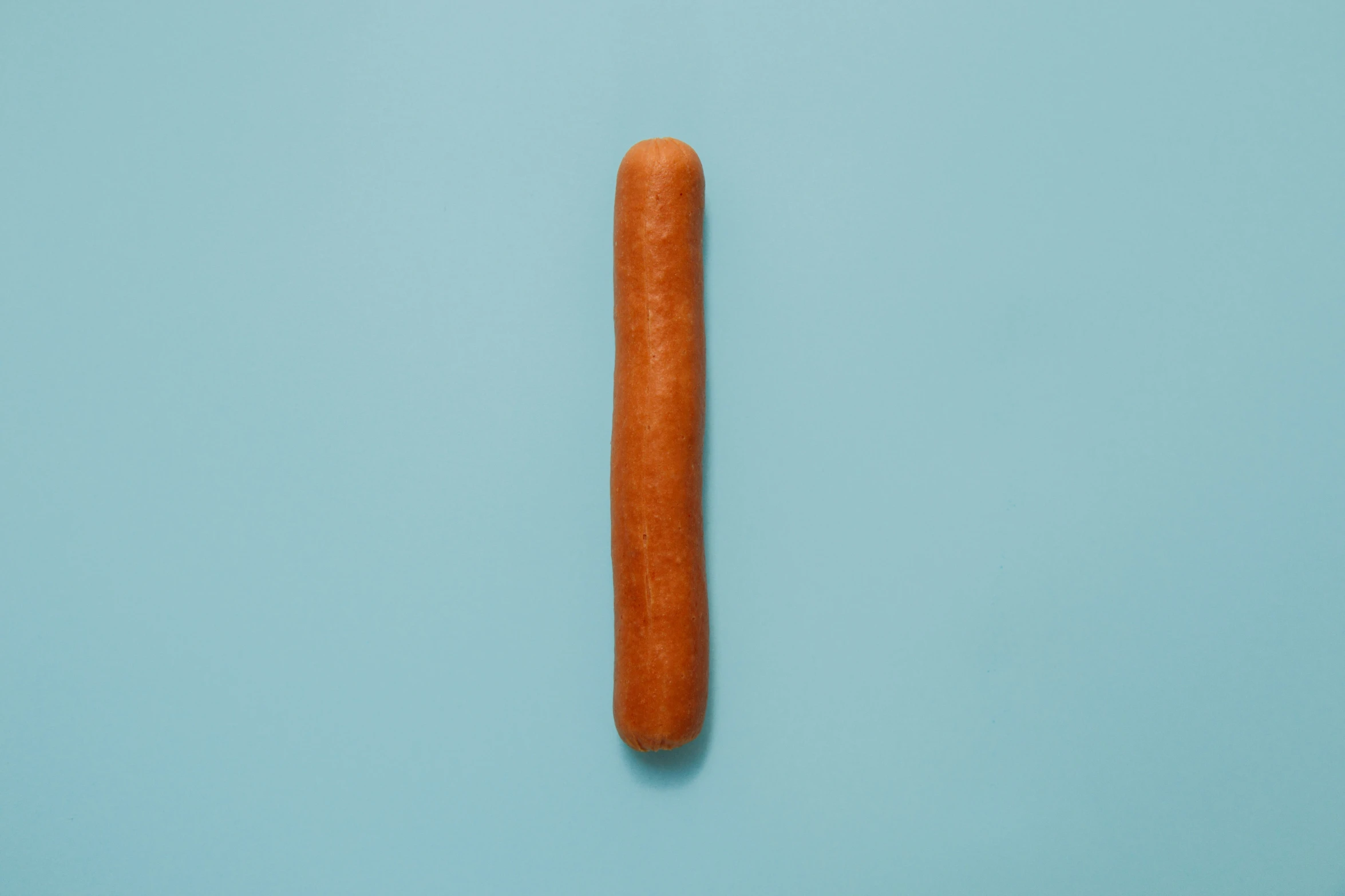 this is a long piece of carrots on a blue surface