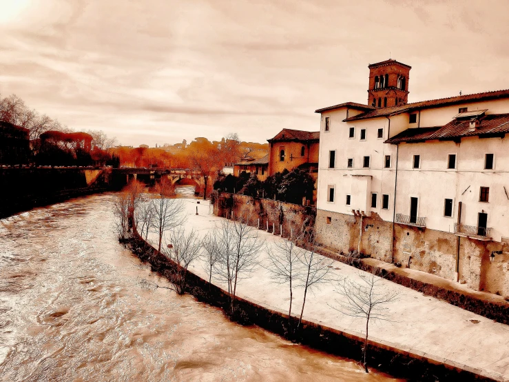 a river with buildings and graffiti on it