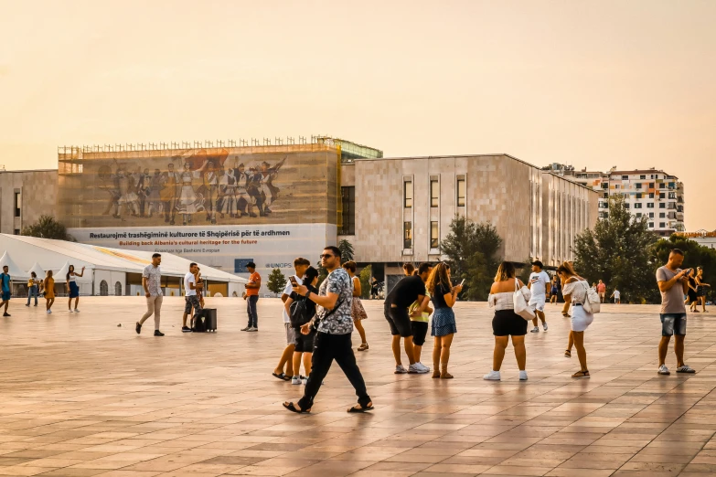 a group of people that are walking in the street