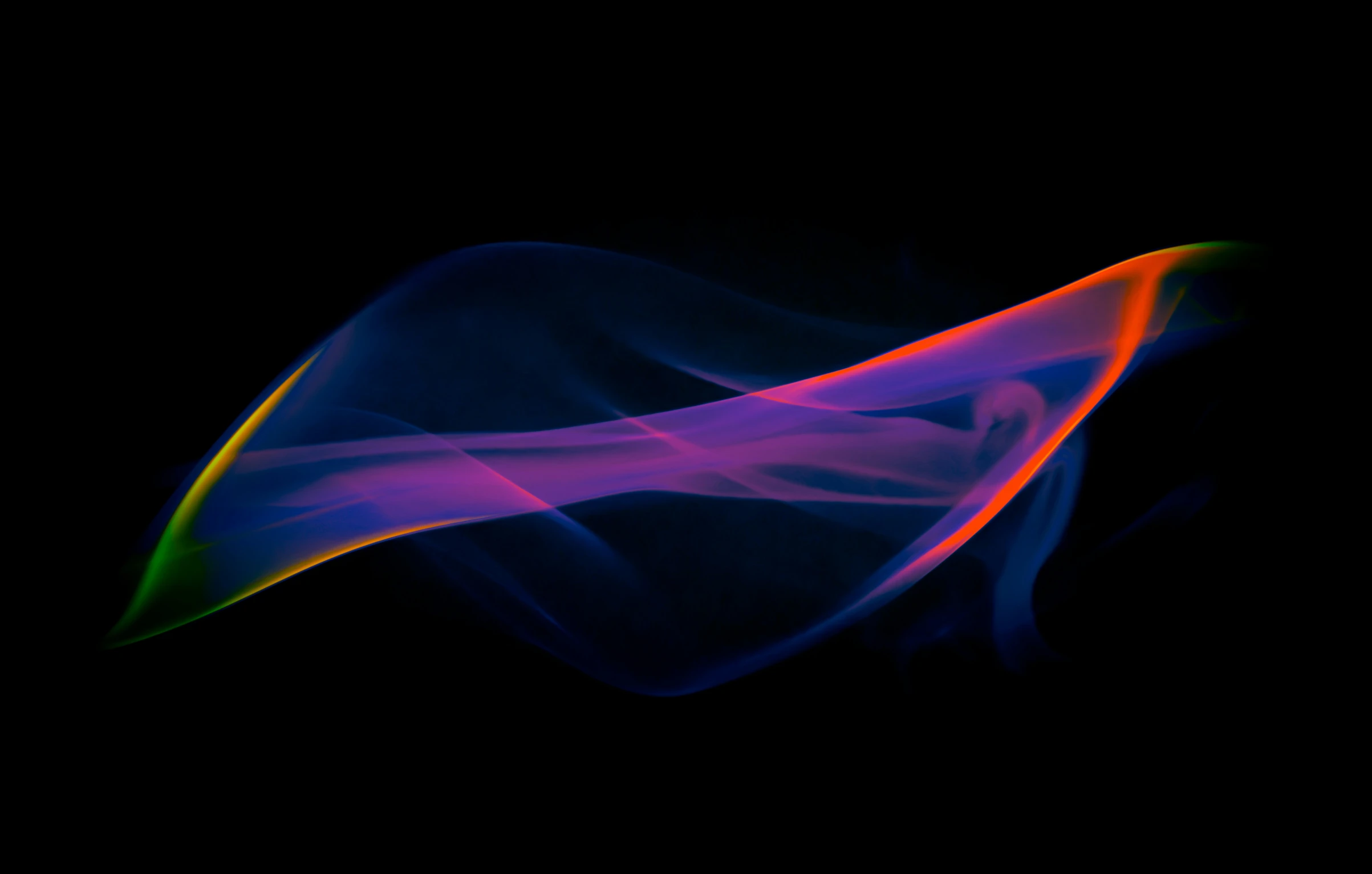 some colorful smoke floating around on a black background