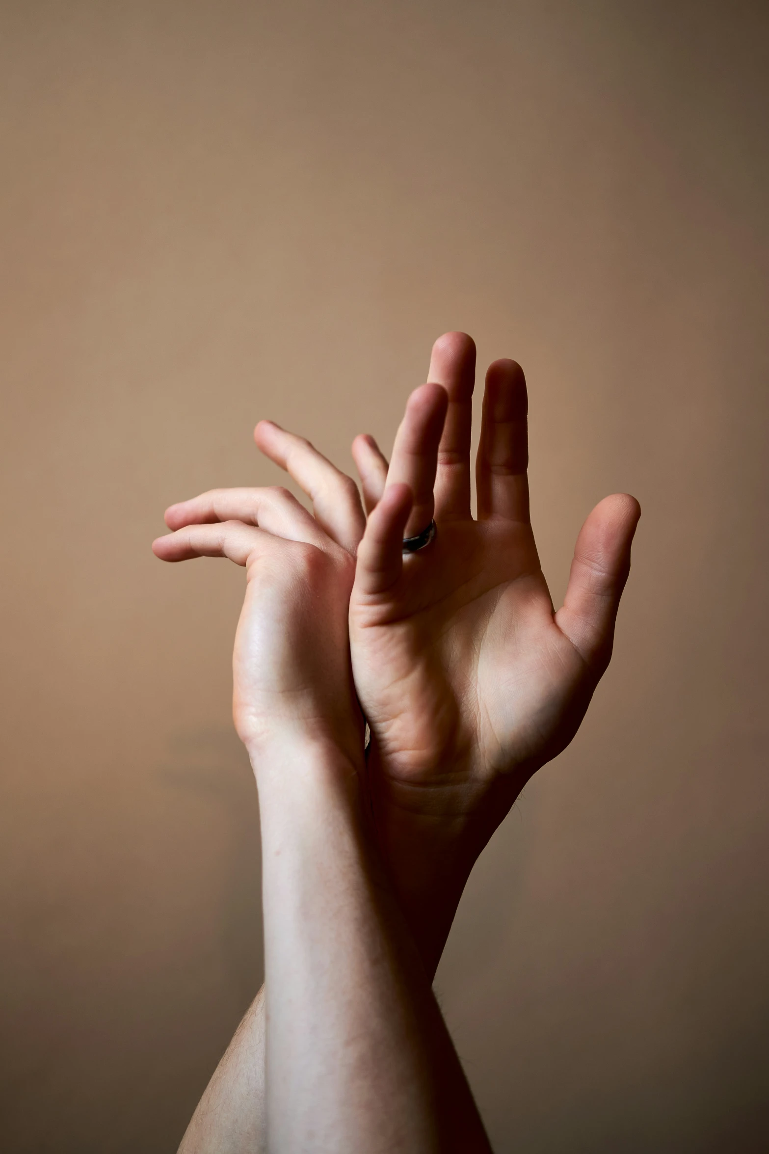 a woman is reaching up into the air with her hand