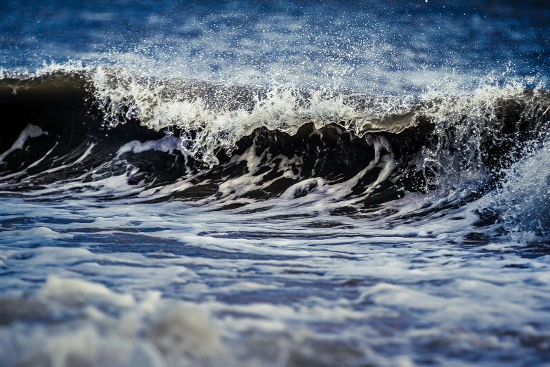 the foamy waves are breaking over the waves