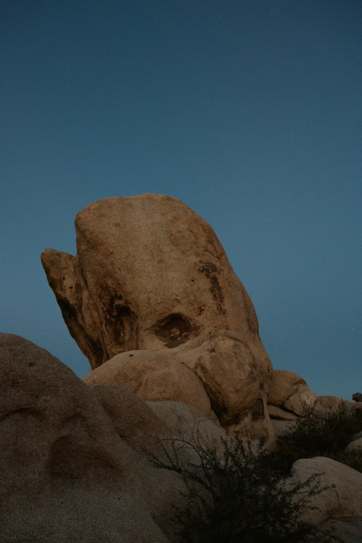 some very big rocks out by the ocean