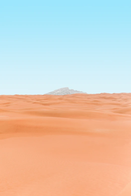 man riding down a large, empty desert