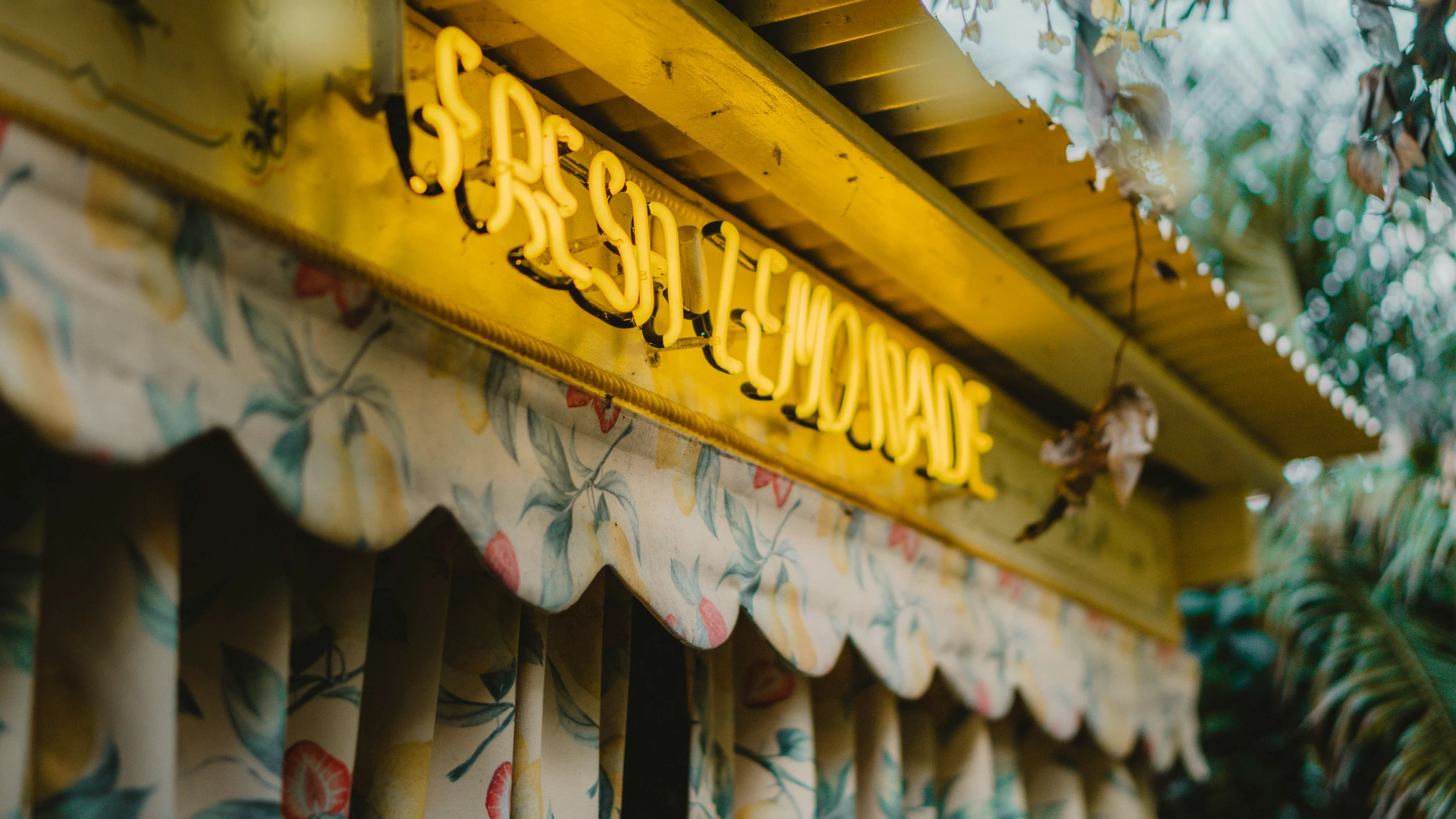 the restaurant is decorated with colorful floral blinds