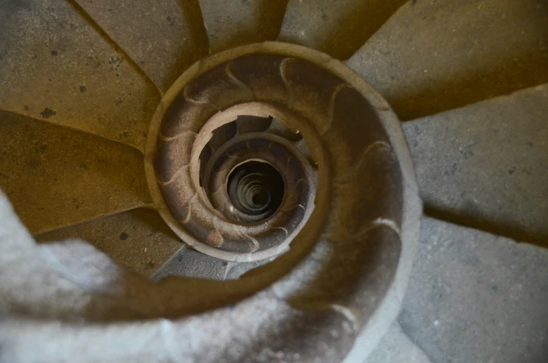 a spiral stair feature, in concrete, with white cloth, close up