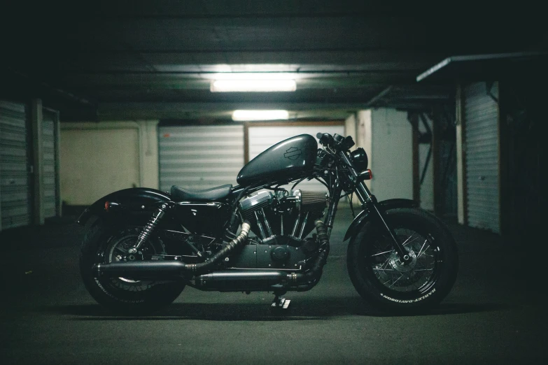 a motorcycle that is sitting in the dark