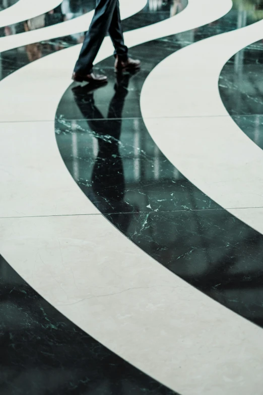 a person with an umbrella walking down the street