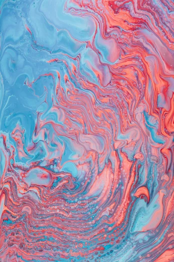 a close up po of pink and blue liquid