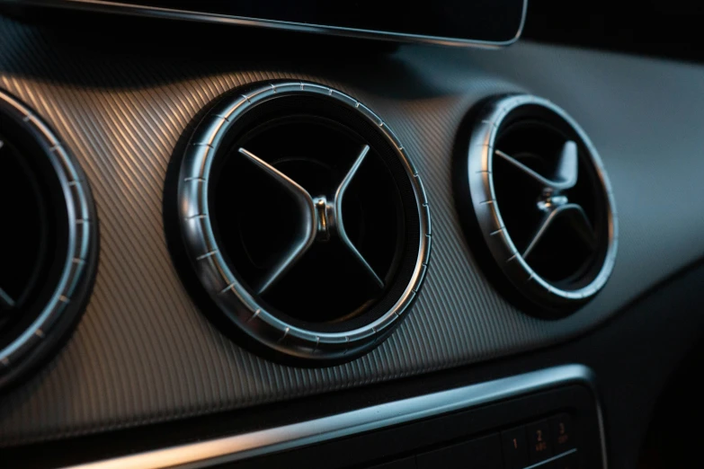 the center console of a car with a black background