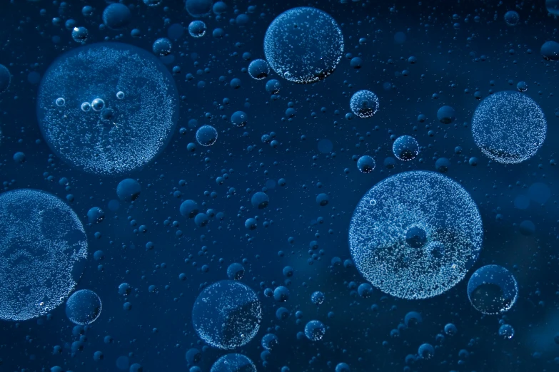 lots of bubbles on a surface, the bottom and top are in blue