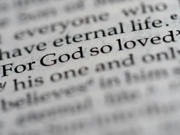 a blurry po of the word god's love on a book page