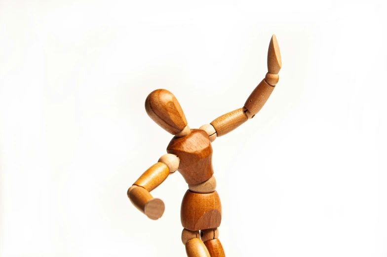 a wooden dummy is holding the leg out